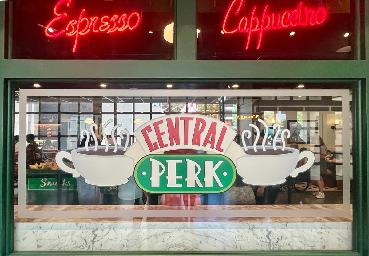 The Central Perk front window, with the coffee-cup sign in it